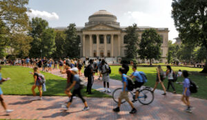 kids walk across college campus